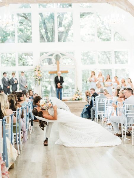 groom-dip-kiss-wedding-aisle-fort-worth-tx